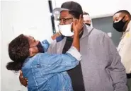  ?? ANDREW NELLES/ THE TENNESSEAN ?? Joseph Webster greets his mother, Marie Burns, as he is released from prison in Nashville on Tuesday. Webster, 41, was released after nearly 15 years in prison serving a life sentence for a crime the courts now believe he didn’t commit.