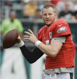  ?? AP ?? The Eagles’ Carson Wentz suffered two torn ligaments in his left knee in December.