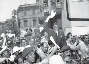  ?? (Wikimedia Commons) ?? ‘AT THAT point a woman shouted from the balcony, “Kakh l’Natzer!”’ – “So too for Egyptian Prime Minister Gamal Abdel Nasser,” pictured being cheered in Cairo after announcing the Suez Canal Company, August 1, 1956.