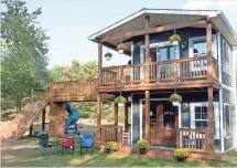  ?? SEAN WORK, SPECIAL TO THE FREE PRESS ?? Adam Boyd built this intricate playhouse in his spare time for his daughters.