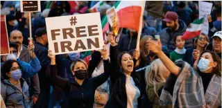  ?? AFP PHOTO ?? UNYIELDING
People demonstrat­e against the Iranian regime during a protest at Mel Lastman Square in Toronto, Ontario on Saturday, Sept. 24, 2022 (September 25 in Manila). Iran has been rocked by street violence since the death last week of Mahsa Amini, a 22-year-old Kurd, who had spent three days in a coma after being detained by the morality police.