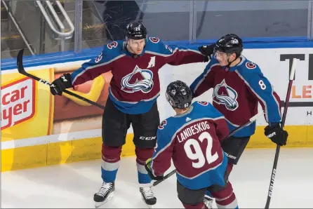  ?? The Canadian Press ?? Colorado Avalanche’s Nathan MacKinnon, Gabriel Landeskog and Cale Makar celebrate against the Dallas Stars during NHL playoff action in Edmonton on Aug. 22.