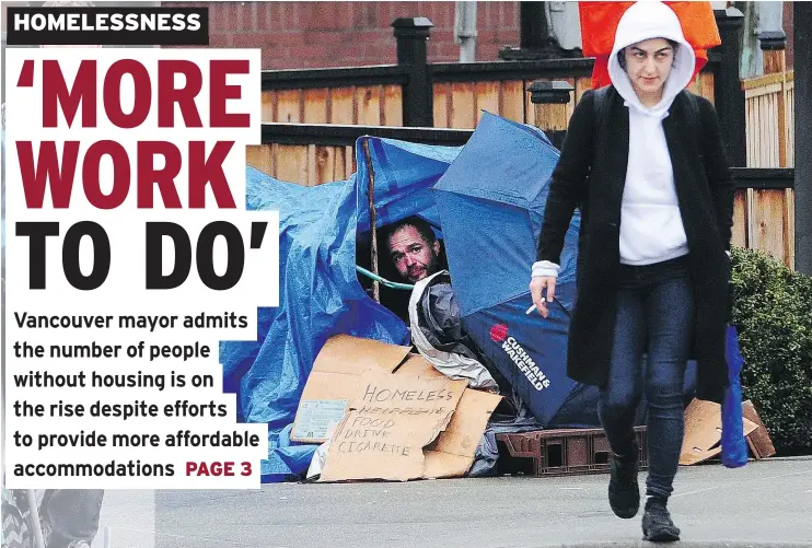  ?? NICK PROCAYLO/PNG ?? A man peers out of a makeshift shelter in Vancouver Wednesday. City officials expect the 2018 homeless count to show an increase in people living on the street.