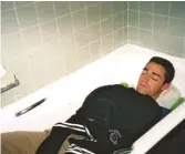  ??  ?? What the deuce! Graham Little sleeps in a Centre Court bath