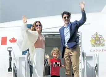  ?? RYAN REMIORZ/THE CANADIAN PRESS ?? Prime Minister Justin Trudeau along with his son Hadrien and wife Sophie Gregoire Trudeau board a plane headed for Dublin, Ireland, on Monday in Ottawa.