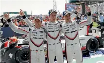  ??  ?? Brendon Hartley, centre, countryman Earl Bamber, right, and German team-mate Timo Bernhard celebrate their stunning victory at Le Mans in June.