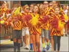  ??  ?? Kids from the lower grades march in the homecoming parade.