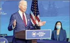  ?? Joshua Roberts / Getty Images ?? President-elect Joe Biden announces members of his climate and energy appointmen­ts, including Rep. Deb Haaland Saturday in Wilmington, Del. Secretary of Interior nominee Haaland is the first Native American nominated to the presidenti­al cabinet.