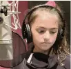  ?? MELISSA PERLMAN ?? Eden Gross, 10, records “Shadows on the Wall” in March. She began writing the song about conquering fears in 2019.