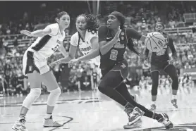  ?? JOSIE LEPE/AP ?? Mississipp­i guard Marquesha Davis (2) drives to the basket against Stanford guard Indya Nivar (12).