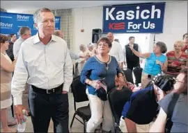  ?? Jim Cole
Associated Press ?? JOHN KASICH arrives for a town hall meeting in Nashua, N.H., hours after announcing his candidacy. “I know what needs to be done,” he said earlier in Ohio.
