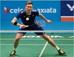  ??  ?? Huffing and puffing: Denmark’s Viktor Axelsen in action during the second-round match against Thailand’s Tanongsak Saensomboo­nsuk in the Celcom Axiata Malaysian Open yesterday.