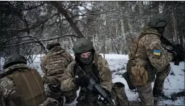  ?? LYNSEY ADDARIO — THE NEW YORK TIMES ?? Soldiers with the Free Russia Legion train in the Kyiv region in Ukraine on Tuesday.