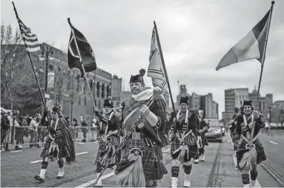  ?? NIC ANTAYA/SPECIAL TO THE DETROIT FREE PRESS ?? Trey Whitehouse of Greenwood leads the Celtic Pipes and Drums during the 66th Annual Detroit St. Patrick’s Parade in Detroit on Sunday.