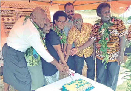  ?? Photo: Shratika Naidu ?? From left: Christian Mission Fellowship pastor Ilisoni Nate, Golden Age Survivors president Poasa Turaga, chief guest Sangam Institute of Technology College of Nursing and Health Care Education director Eleni Kata, Labasa Golden Age Home resident Amrit Prasad, Golden Age Home senior welfare officer Josefa Ratawake and Nacanieli Nasora from Macuata Provincial Office cutting the cake during the Internatio­nal Day of Older Persons at Katonivere Ground in Labasa on October 1, 2020.