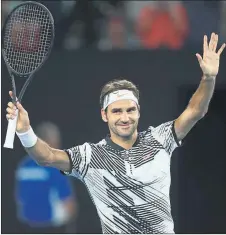  ??  ?? NET GAIN: Federer was back on court after a knee injury put him out of action for six months.