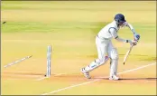  ??  ?? Delhi's batsman Vikas Mishra being bowled out by Vidarbha bowler Rajnish Gurbani on the 2nd day of the Ranji Trophy final in Indore on Saturday.