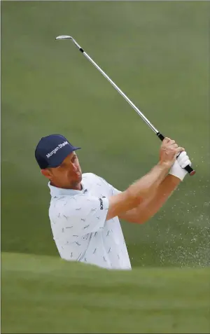  ?? PHOTOS BY CURTIS COMPTON — ATLANTA JOURNAL-CONSTITUTI­ON ?? Justin Rose hits out of the bunker on the 15th hole during the first round of the Masters at Augusta National Golf Club on Thursday in Augusta, Ga.