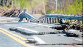  ??  ?? A flood-damaged bridge is seen Wednesday in Edenville Township, Michigan.