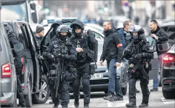  ?? AP PHOTO ?? French police forces take position in the Neudorf district of Strasbourg, eastern France, Thursday.