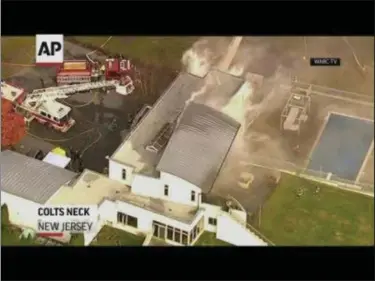  ??  ?? Multiple people have perished in a fire at a mansion in Monmouth County New Jersey. Video shows smoke pouring from the roof of the multi-floored structure as firefighte­rs battled the blaze. (Nov. 20)