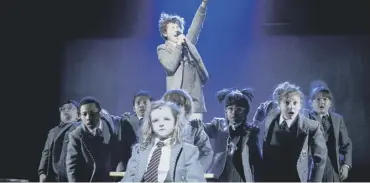  ??  ?? Tim Minchin, main; performing a song from Matilda, top; a scene from the hit musical, above