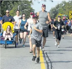  ?? JULIE JOCSAK/STANDARD STAFF ?? The 37th running of the St. Catharines Terry Fox Run was moved to Brock University because of flooding in Lakeside Park. The move has not hurt the run which took place on Sunday.