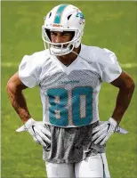  ?? ALLEN EYESTONE / THE PALM BEACH POST ?? “We’re brothers now,” Dolphins receiver Danny Amendola (80) said of cornerback Bobby McCain. “We play on the same team, so we’re going to fight together.”