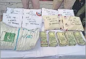  ?? ANI TWITTER ?? The smuggled packets of heroin-like substance and cash recovered by Kupwara police on Saturday.