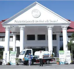  ??  ?? HFI president Maria Fe Perez-Agudo (left) turns over a Hyundai HD36 truck, customized into a water delivery truck, to Tanay Mayor Rex Tanjuatco