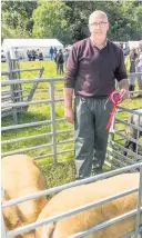  ??  ?? Continenta­l breeds Sheep champ Jim Bunny girl Ida Pickens with her awardwinni­ng Hodge from Auchinleck brace of rabbits Ryden and Ralph