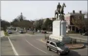  ?? STEVE HELBER — THE ASSOCIATED PRESS ?? Traffic passes by the statue of Confederat­e General Stonewall Jackson Sunday at the intersecti­on of Monument Avenue and The Boulevard in Richmond, Va. A city councilwom­an and others are attempting to get the Boulevard named after tennis star Arthur Ashe.