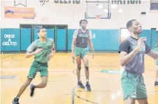  ?? — AFP photo ?? Congolese basketball player Jonathan Kuminga (centre) is seen during practice at Patrick School, in Hillside New Jersey.