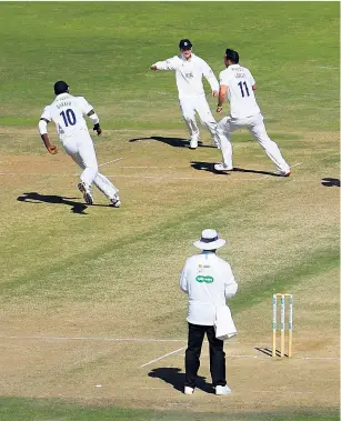  ??  ?? Destroyer: Hampshire celebrate after Kyle Abbott dismisses George Bartlett