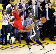  ?? Associated Press ?? DENIED — Golden State Warriors’ Andre Iguodala, right, strips the ball from Portland Trail Blazers’ Damian Lillard during the final seconds of Game 2 of the Western Conference finals on Thursday in Oakland. The Warriors won 114-111.