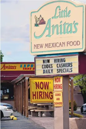  ?? JIM THOMPSON/JOURNAL ?? Restaurant­s in Albuquerqu­e display a variety of signs soliciting new employees.