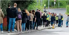  ?? PICTURE: SWNS ?? Uptake: Large queues form for vaccinatio­ns yesterday at Bolton’s Essa Academy. Right, our India ‘red list’ front page