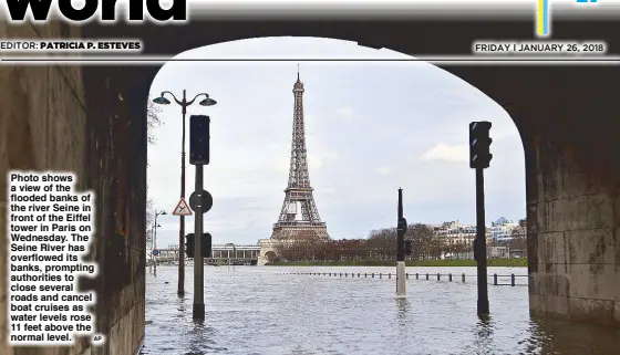  ?? AP ?? Photo shows a view of the flooded banks of the river Seine in front of the Eiffel tower in Paris on Wednesday. The Seine River has overflowed its banks, prompting authoritie­s to close several roads and cancel boat cruises as water levels rose 11 feet...