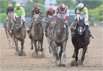  ?? GEOFF BURKE, USA TODAY SPORTS ?? Javier Castellano and Cloud Computing (2) rallied to beat Classic Empire in the Preakness.