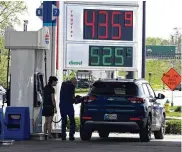  ?? BILL LACKEY / STAFF ?? A motorist fills up at a Springfiel­d gas station that was selling gas for $4.35 a gallon Tuesday.