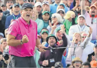  ?? CURTIS COMPTON/ATLANTA JOURNAL-CONSTITUTI­ON VIA AP ?? Patrick Reed makes a par putt on the 18th green to win the Masters at 15-under par at Augusta National Golf Club on Sunday.