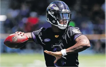  ?? — THE ASSOCIATED PRESS ?? Baltimore Ravens rookie quarterbac­k Lamar Jackson throws a pass during a training camp practice at the team’s headquarte­rs in Owings Mills, Md.