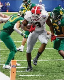  ?? BOB ANDRES/BANDRES@AJC.COM ?? Running back Zamir White gets high marks from new offensive coordinato­r Todd Monken, tasked with bringing “explosivit­y” to the Bulldogs’ offense this season.