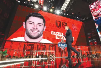  ?? RONALD MARTINEZ/ GETTY IMAGES ?? Commission­er Roger Goodell leaves the stage after announcing Baker Mayfield, who wasn’t present.