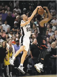  ?? Eric Gay / Associated Press ?? San Antonio’s Manu Ginobili blocks a three-point shot by the Rockets’ James Harden in the final second of overtime.