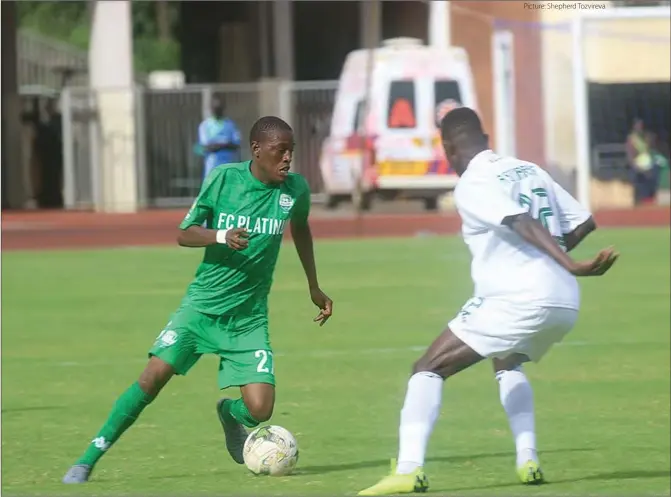  ?? Picture: Shepherd Tozvireva ?? FC Platinum forward Gift Mbweti tries to dribbles past an SC Jaraaf player at the National Sports Stadium in Harare yesterday