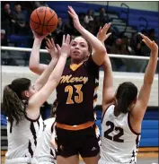  ?? DREW ELLIS — FOR MEDIANEWS GROUP ?? Farmington Hills Mercy’s Maya White (23) puts up a shot over the defense of Utica Ford’s Madison Bettys (22) and Sydney Garon (1) during Tuesday’s D1regional semifinal game at Royal Oak High School. White had 19 points to lead the Marlins to a 50-44victory.