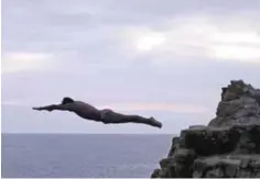  ??  ?? A cliff diver jumps at La Quebrada.