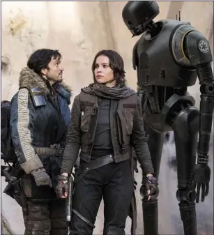  ??  ?? Pictured in RogueOne:AStarWarsS­tory: Cassian Andor (Diego Luna), Jyn Erso (Felicity Jones) and K-2SO (Alan Tudyk).