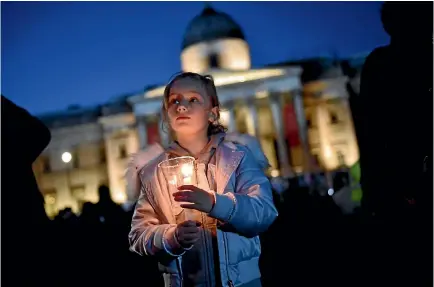  ?? PHOTO: REUTERS PHOTO: REUTERS ?? People light candles at a vigil in Trafalgar Square to remember the victims of the London terror attack. The city’s mayor, Sadiq Khan, told the gathering that ‘‘Londoners will never be cowed by terrorism’’.